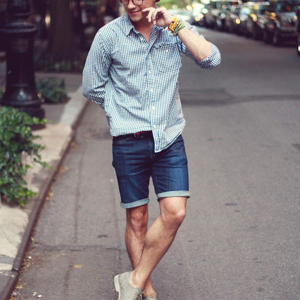 man wearing short jean shorts