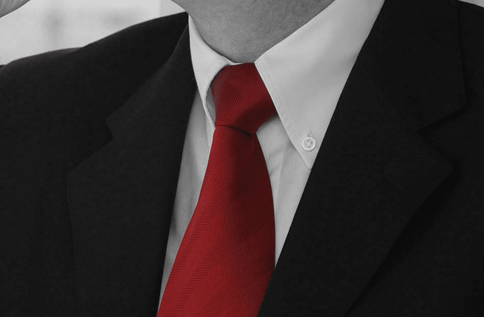 black suit and red tie