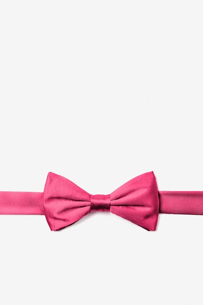 Boy wearing a solid hot pink bow-tie